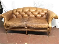Curved leather tufted couch