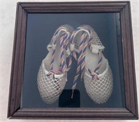 Vintage shoes in shadow box