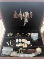 Man’s jewelry box full of cuff links tie tacks