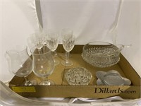 Box with tea glasses, wine glasses, and candy