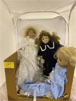 Box of three dolls