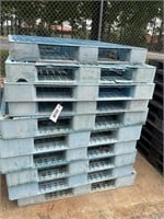 STACK OF PLASTIC PALLETS