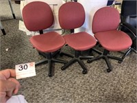 3 Red Office Chairs on Rollers