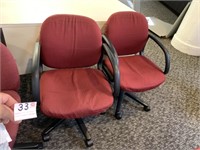 2 Red Office Chairs on Rollers