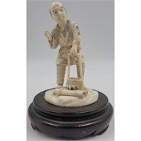 A Finely Carved Workman With a Knife