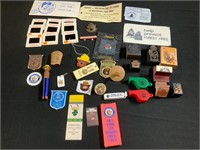Rubber stamps, pins, whistles