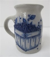 1997 Stone ware crock pitcher with blue slip.