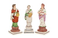 THREE STAFFORDSHIRE POTTERY PEARLWARE FIGURES