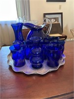 Cobalt blue pitcher glasses and small vases