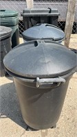 Three trash cans with lids and wheels