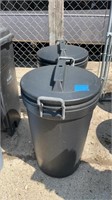 Two Rubbermaid trash, cans with lids and wheels