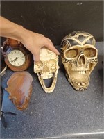 3 skulls: one is a clock