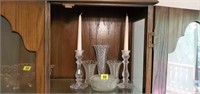 Shelf of glassware, candlesticks, vases