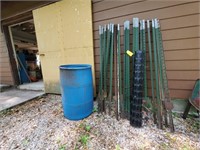 Plastic barrel, snow fence, fence posts