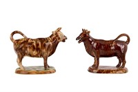 TWO ENGLISH POTTERY COW CREAMERS