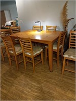 Nice bar height table and 8 chairs has leaf that