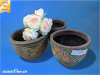 Three decorative flower pots and silk roses