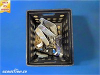 crate of stirrups horse brushes and other groomins