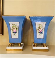 Pair of porcelain vases with lion paw feet,