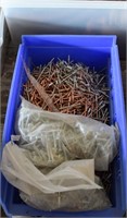Box of copper and metal rivets and screws