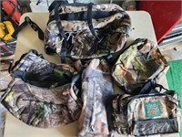Lot of camo hunting backpacks, muffs and bags