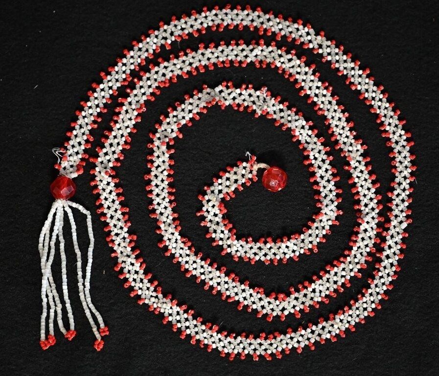 Early Beaded Necklace with a bunch of small red an