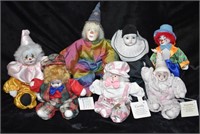 7 Hand Painted Porcelain and Bisque Clown Dolls