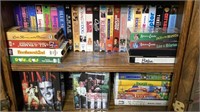TWO SHELVES OF VHS TAPES