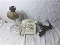 Rotary phone, broken apple peeler, glass kerosene