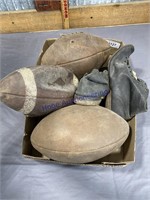 FLAT OF OLD FOOTBALLS, SHOES