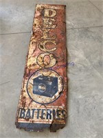 DELCO BATTERIES TIN SIGN, RUSTED/ BENT,