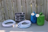 garden hoses and watering cans