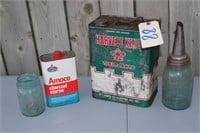 advertising tins and oil bottle