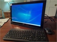 Dell Inspirion 20 computer, Logitech keyboard,