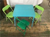 CHILDS FOLDING TABLE AND 3 FOLDING CHAIRS