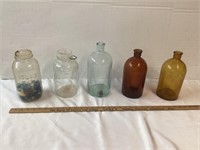 5 GLASS JUGS 1 ATLAS WITH MARBLES