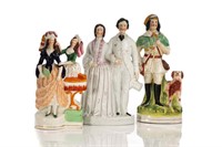 THREE STAFFORDSHIRE POTTERY FIGURAL GROUPS