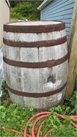 A WOODEN BARREL, 36 INCHES HIGH, 22 INCHES ROUND,