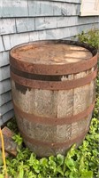 A WOODEN BARREL, 36 INCHES HIGH, 22 INCHES ROUND,
