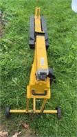 AN ELECTRIC LOG SPLITTER, 4 FEET LONG, 3 FEET