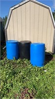 THREE PLASTIC BARRELS