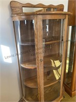 Bowed front wooden display cabinet approximate