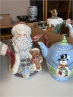 Box of Christmas themed teapots