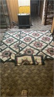 Two twin size store quilts and 3 shams