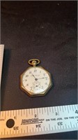 Trans Pacific gold pocket watch