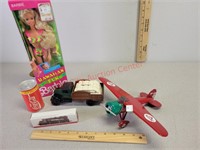 Barbie doll, Conoco plane, Coca-Cola golf balls