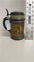0.5 L Mettlach stein with cherubs, pottery and