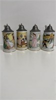 Set a four small German storybook steins with