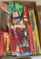 box of drill bits mostly new in package