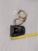 Vintage handcuffs and leather case with keys
